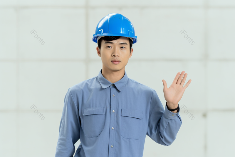 穿着工作服带着安全帽的工程师挥手的照片,高清,摄影图,摄影图片,图片大全,摄影图免费下载